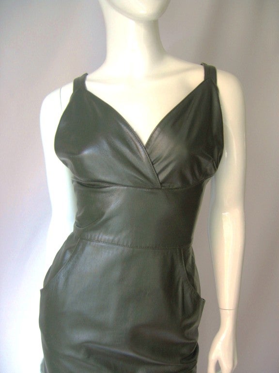 Beautiful deep forest green leather maxi dress from Fendi. Fitted from bust line to mid calf where an attached flounce flairs to the feet creating a 'mermaid' effect.  Cross over style bra attaches to a fitted band to the waist.  The back of the