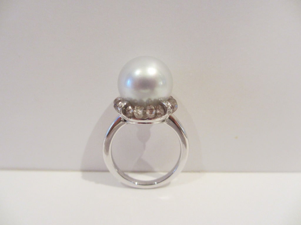 12mm White South Sea Pearl set in 18K White Gold, and delicately surrounded by brown diamond beads and white diamond detail