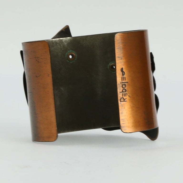 Spectacular Comedy and Tragedy Copper Cuff Bracelet with the copper faces riveted to the wide cuff; signed REBAJES. Add a little Drama to the everyday with this Chic Bracelet
