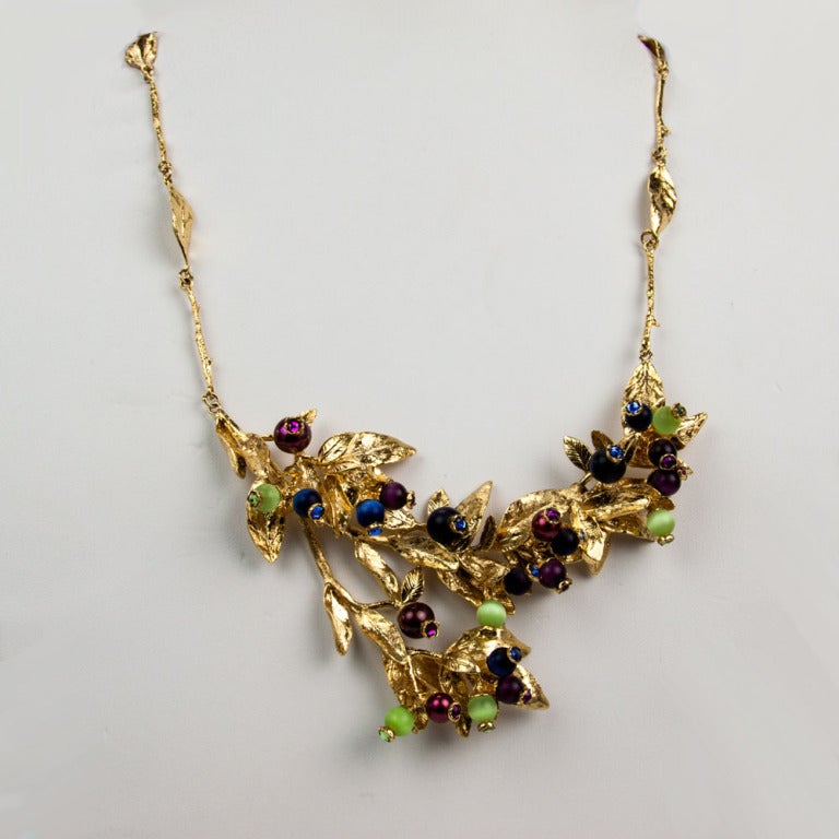 Stylish Vintage Gold plated Sterling Silver grape leaf vine Lavaliere Necklace features detailed leaf links necklace leading to a leaf vine dripping with a pendant of leaves and colorful glass and crystal berries. Marked on verso and hanging chain