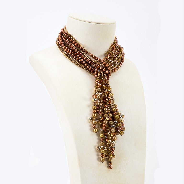 Sensational five strand Necklace comprising Golden Bronze Pearls of various shapes and sizes and bronze and clear Crystals; can be worn as a single, double, triple stand or all together, making a statement, so reminiscent of the roaring 1920s! A