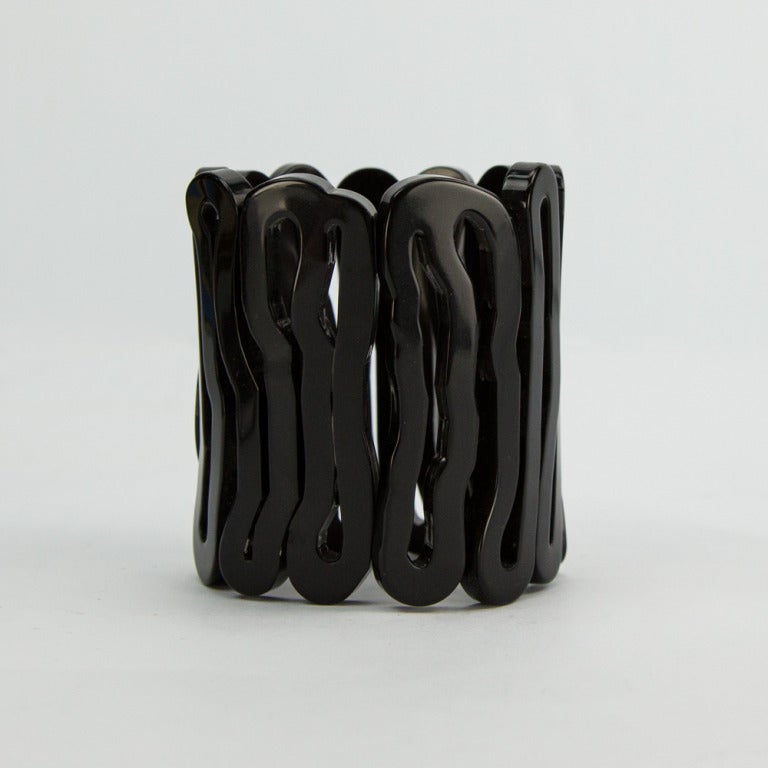 Fabulous Black Celluloid 'Spiral' Clamper Cuff Bracelet; opening for easy ‘on & off’  measures approx. 2.25 inch in diameter and 3 inch wide; Also available in red; Add pizazz to any outfit with this Dynamic Show Stopper!  
