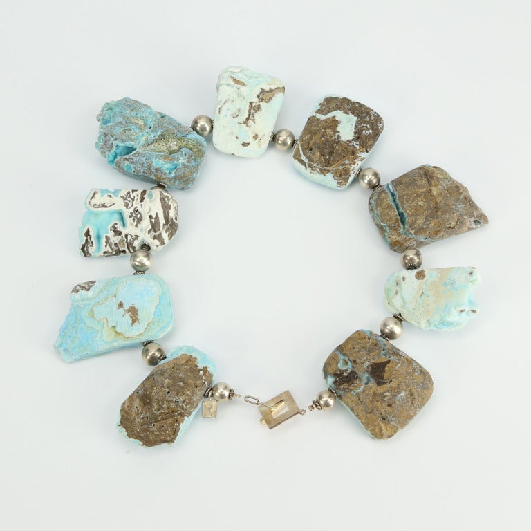 Dynamic High Quality Hand Carved and Polished Natural Rock Turquoise Quartz Druzy Necklace inter-spaced with Sterling Silver Beads; infusing your outfit with grand style and textured detail. Boasts raw texture and bold statement style in this