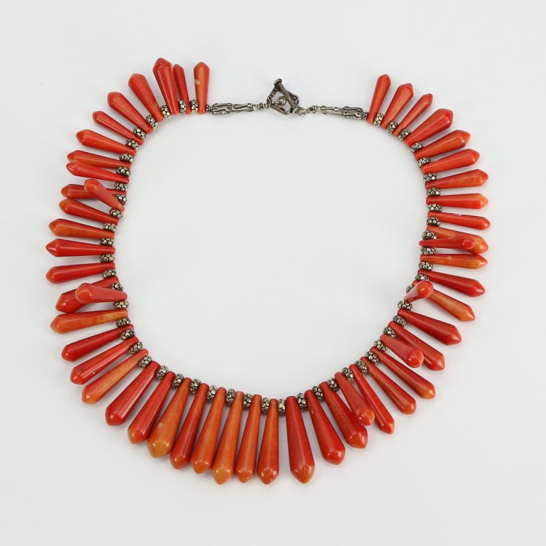 Beautiful Red Coral Briolettes Necklace inter-spaced with Sterling Silver Rondelle Spacers held by a decorative Sterling Silver Toggle style Clasp. A piece you’ll turn to, time and time again!