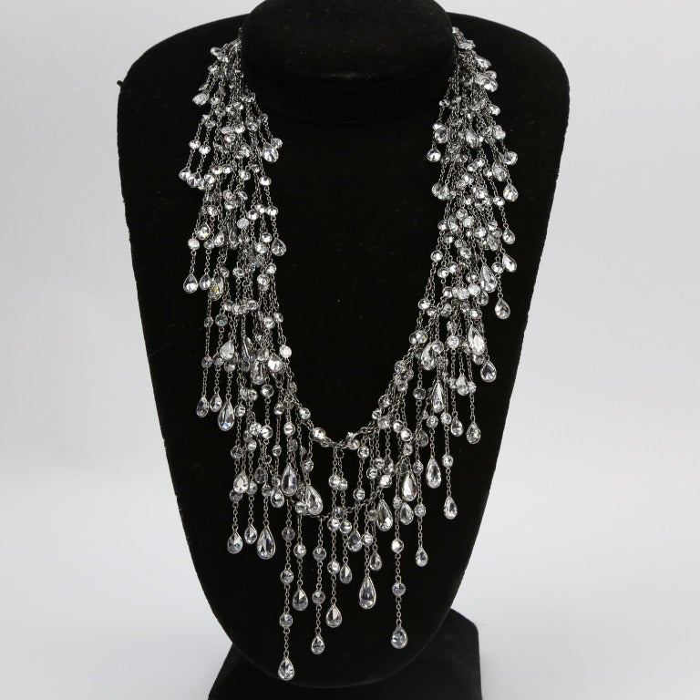 Beautiful and Alluring Swarovski Crystal Cascade Necklace; sterling silver, encased in black rhodium finish; crystal drops, cascading several times around the neck, make this super fun necklace perfect for day or night. Signed, Approx. length: 60