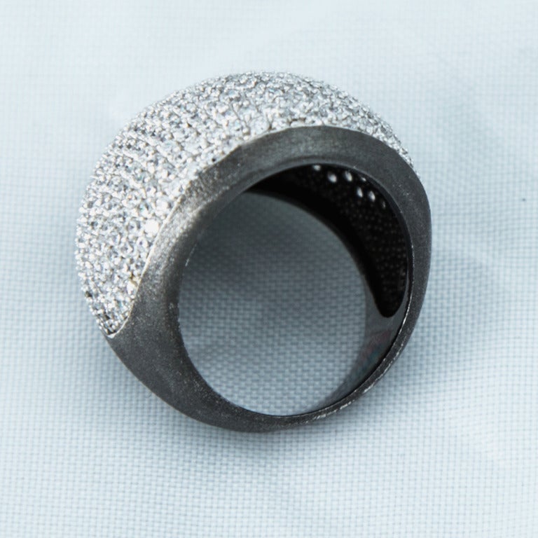 Striking Disco Dome Ring, encrusted with sparkling Swarovski crystals, pave set in sterling silver with black rhodium. Add a little magical contemporary edge to any look!