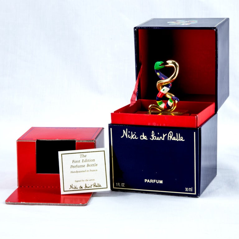 Niki de Saint Phalle painted resin Snake design Perfume Bottle with a blue tinted glass bottle only (no perfume) in original box. c1982. Highly collectible, a great opportunity to start a collection or add to one!