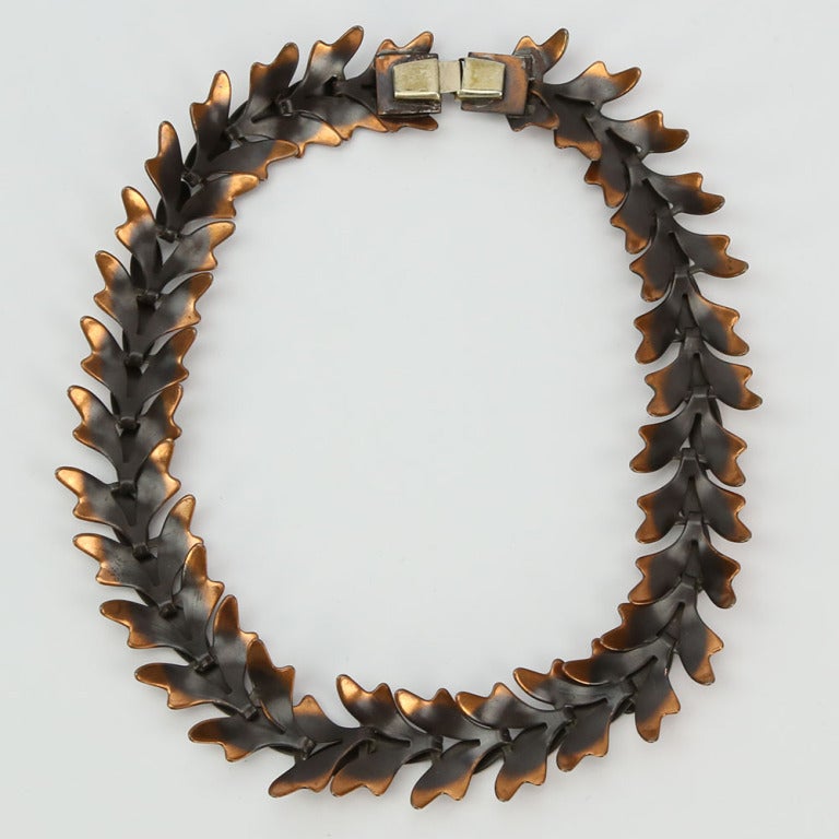 Modernist Copper Necklace featuring linked Cascading Leaves; invisible box clasp; signed REBAJES. Measuring approx. 15.5