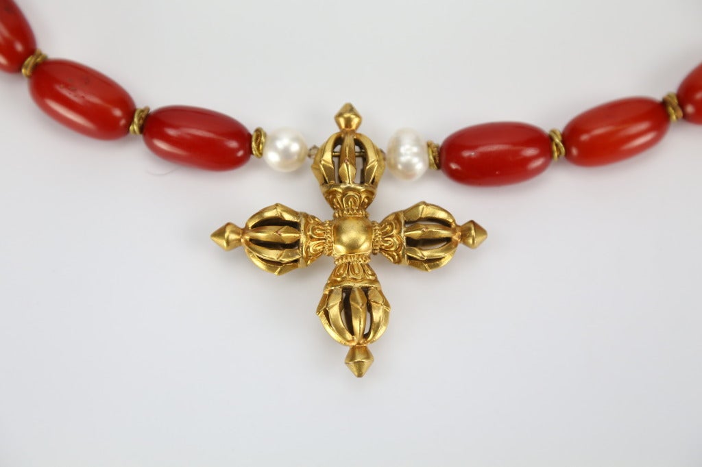 Fabulous One-of-a-Kind Red Amber and Baroque Pearl Necklace inter-spaced with Bronze spacers, suspending a Bronze Visvavajra; necklace:19 inches long; Visvavajra pendant: 2.5