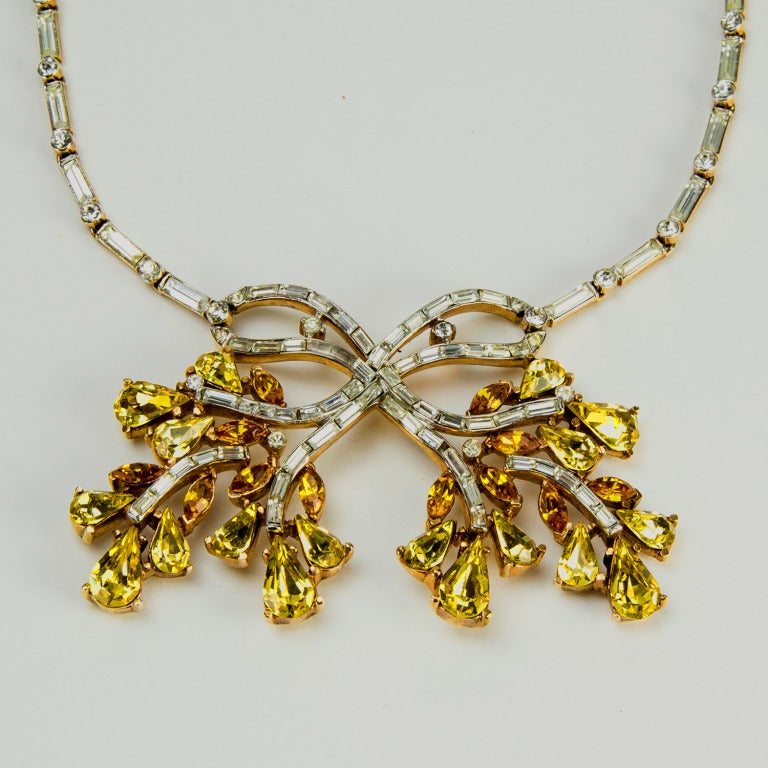 Beautiful and rare signed 1940s Trifari necklace encrusted with sparkly clear, citrine and topaz crystals, encompassing baguettes, teardrops and rounds. Marked: TRIFARI with a crown and PAT.PEND. which dates it to pre-1950 when the patent was