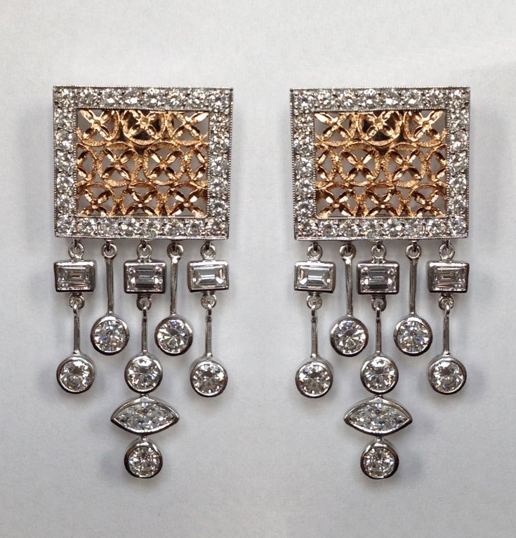 Dalben design Diamonds pendant earrings mounted in 18 kt white and rose gold with round brillant cut diamonds total weight 1,50 carats , marquise and baguette cut diamonds weighting approximately 0,90 carats .
The earrings are completely hand made