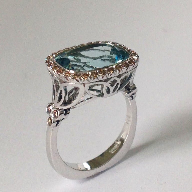 Dalben design Aquamarine And Brown Diamond Ring mounted in 18 kt white gold.
Cushion cut Aquamarine weighting 5,58 carat , round brillant cut brown Diamonds weighting  0,40 carats.
The ring is completely hand made in our atelier in Italy Como with