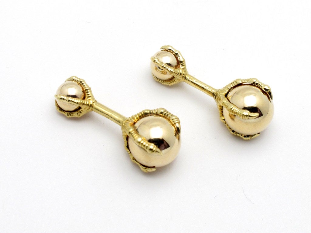 Signed Tiffany & Co. 18 karat gold cufflinks in ball and claw motif.