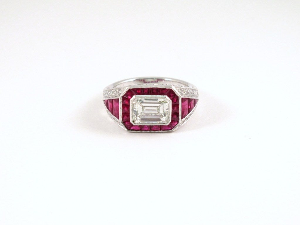 The beautiful Art Deco style diamond ring consists of a central emerald cut diamond weighing 1.58 carats, color: H, clarity: VVS1 , which includes an EGL New York certification. 
The mounting contains 0.29 carats of round brilliant diamonds and