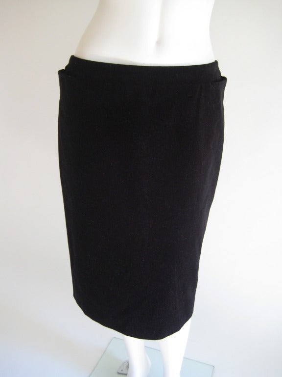 1990s/early 2000s. Jet Black Velvet Skirt. Pockets on sides and back. Zipper in back. Slightly low on hips. Fully lined in black. Small slit in back. Flattering cut. 100% Cotton. EU Size 44. US 10.