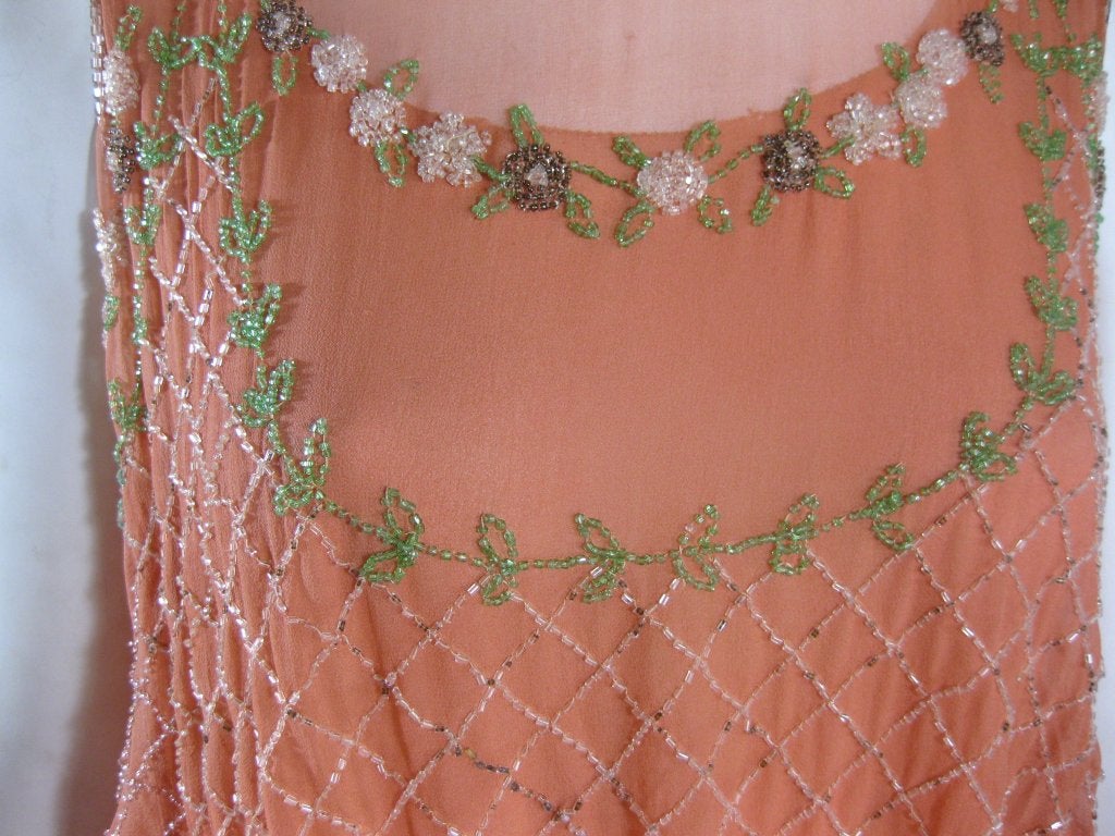 Fabulous 1920s 2 Piece Peach Sheer Silk Chiffon with multi colored green, amethyst and white beadwork. Sheer chiffon. Approximate Modern Day Size 4.