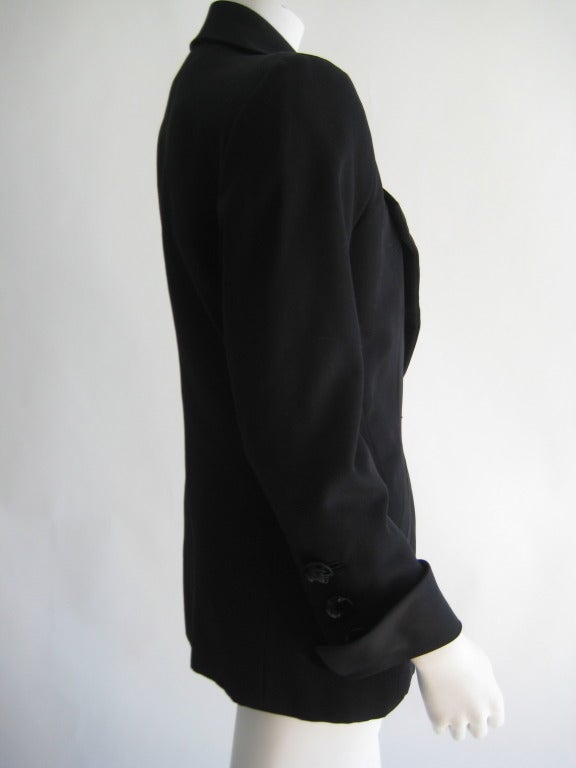 1980s - 90s Yves Saint Laurent Tux Jacket. Black Sequin buttons. Fully lined.
Tag size 38