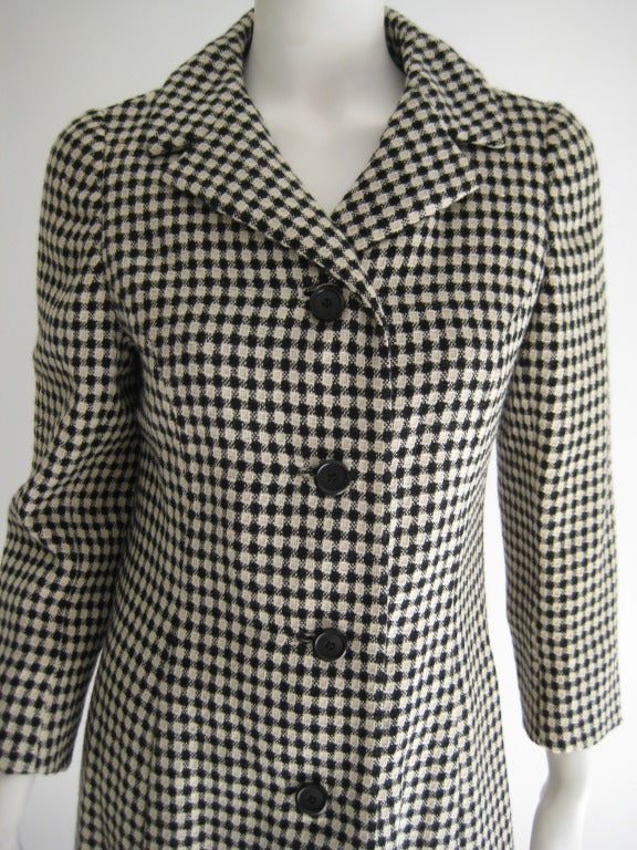 1960s Holt Renfrew Mod Black and White Coat and Dress Ensamble Wool Dress and Coat. Coat is black and white check like pattern with black buttons. and dress is entirely black. Both are fully lined in black. Pocket on side hip of both coat and dress.