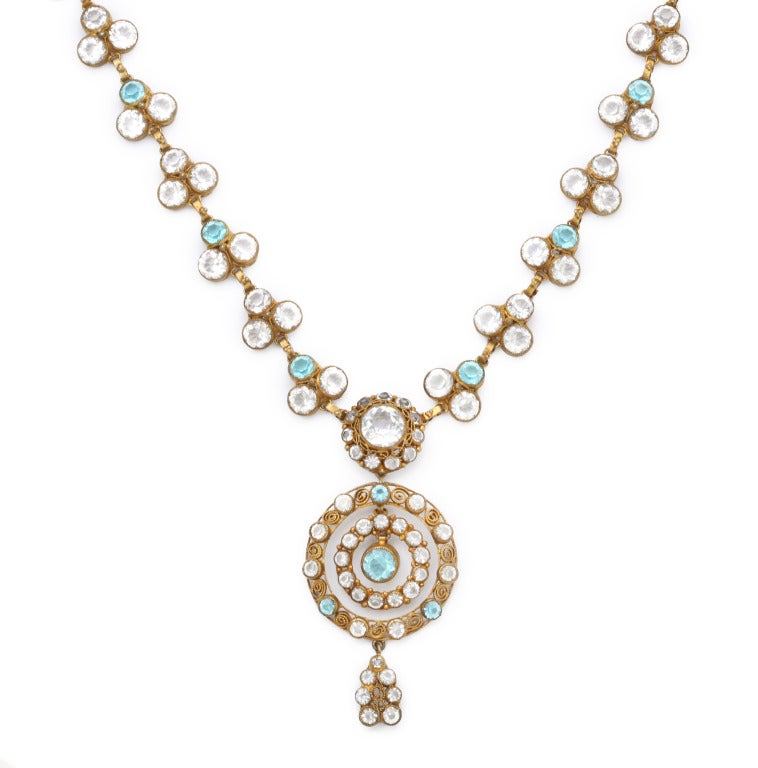 1930's Hobe necklace in gilt filigree metal, with clear and aqua colored  Bohemian crystals, with detachable pendant. Unmarked, clasp shows  4 lines of crossed out letters and numbers. Length 19 in.