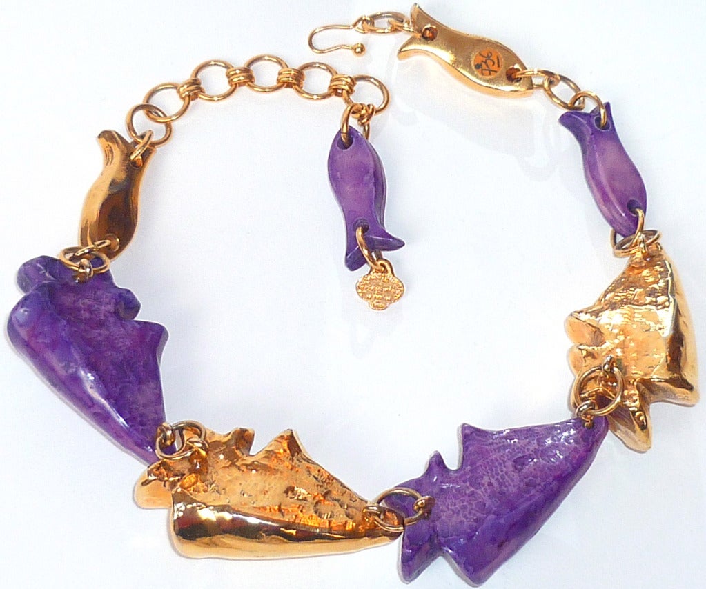 This beautiful Yves Saint Laurent necklace was worn in a 1980s Haute Couture runway show, made of gilded and purple resin molded as large shells and fishes.This item is directly sourced from Paris and still shows on a paper tag the number of the