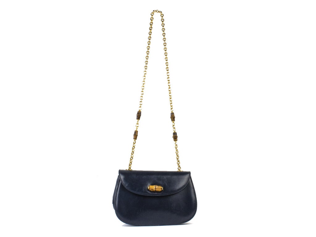 Absolutely adore this timeless classic! Wear it as a shoulder bag or wear it as a crossbody -- either way you'll be chic as can be in this stunning Gucci number! Chain is done in gold-tone hardware with bamboo turn lock at the flap. Interior