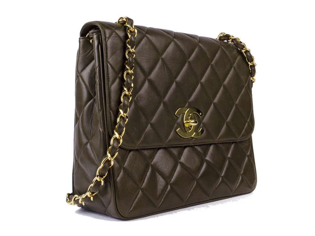 Dress up in class with this gorgeous Chanel Vintage Brown Quilted Lambskin Large Classic Flap Bag. The black quilted lambskin leather is soft and supple and features a large golden turnlock CC closure. An elegant and timeless piece to add to any