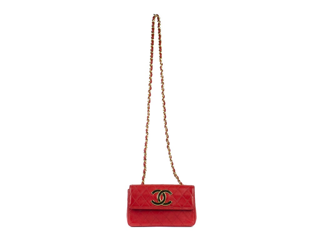 Drop the necessities into the fire-engine red Chanel flap bag and get ready for an unforgettable evening. Coordinate with red-bottomed Louboutins and gold accessories for a look with limitless possibilities. Featuring double-stitch quilting with