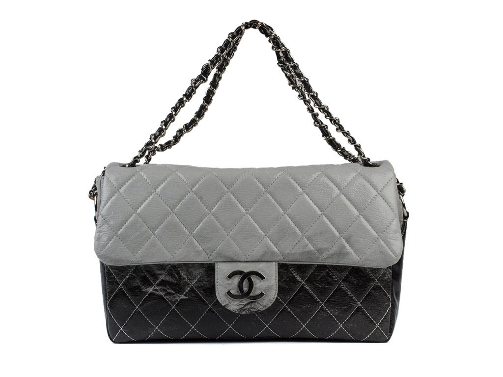 Ombre and Chanel are always in! Invest in both and add the Chanel ombre jumbo flap to your wardrobe. Light gray quilted patent leather at top darkens into black at bottom, creating an eye-catching two-tone handbag that will transition seamlessly