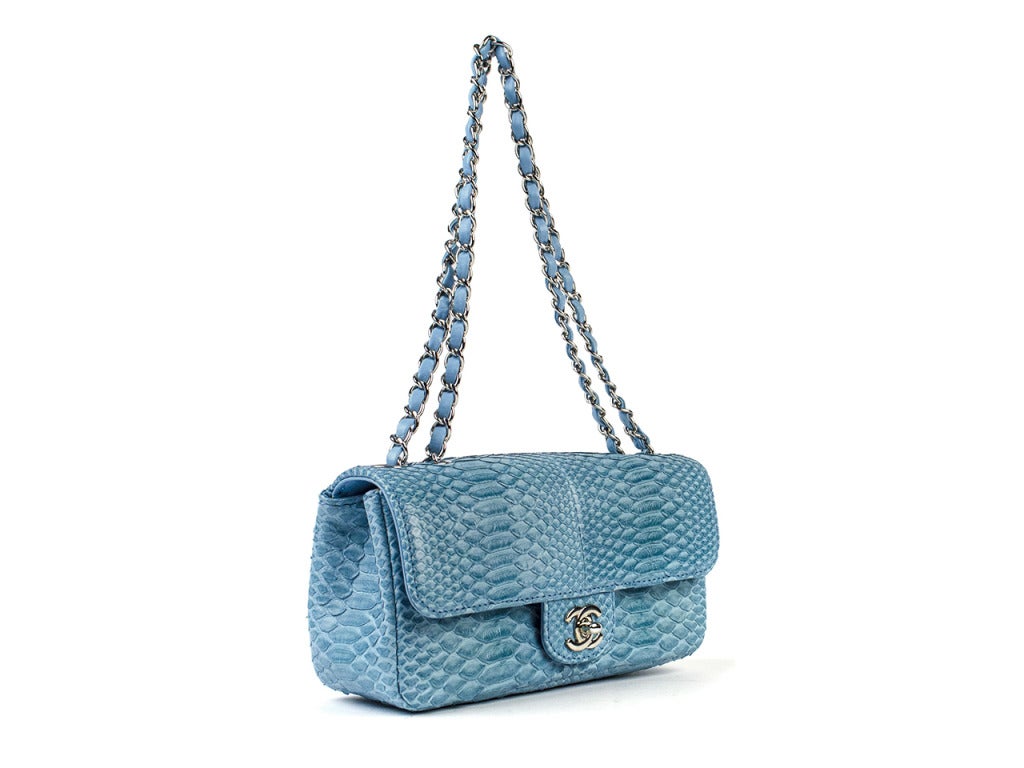 Perfect for the CHANEL collector! CHANEL python east west flap bag is featured in light blue python with silver hardware, double shoulder straps with 9