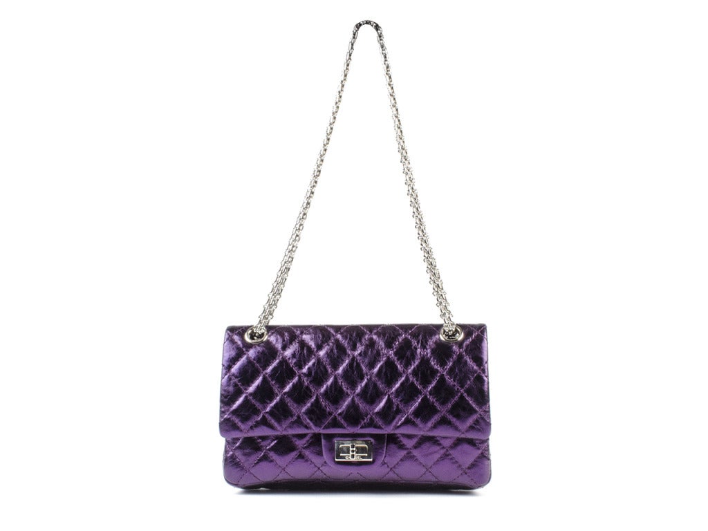 A rare find & perfect for your collection! CHANEL Purple Metallic 2.55 Quilted Reissue Flap Bag is in brand new condition with original tags attached! This bag features purple metallic leather throughout, silver hardware, twist lock.