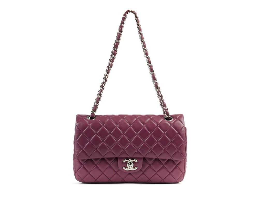 A rare gem! CHANEL limited edition violette medium will be a surefire favorite in your Chanel collection! This bag features traditional diamond quilting pattern, silver hardware, wrapped leather chain, exterior pouch pocket, double flap closure, two