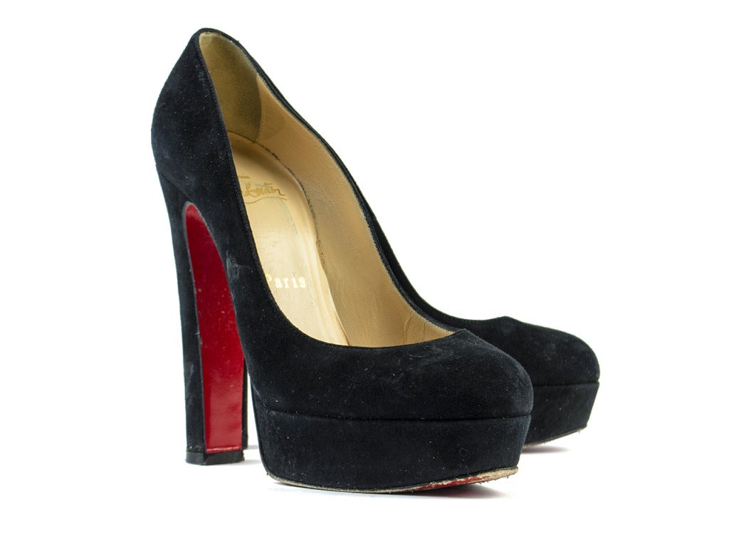 Classic red-bottom pumps with chunky spunk! The Christian Louboutin black suede Bibi platform heels and that oh-so-you cocktail dress you've been eyeing belong together like champagne and Chambord. Featuring round toe, thick 5.25