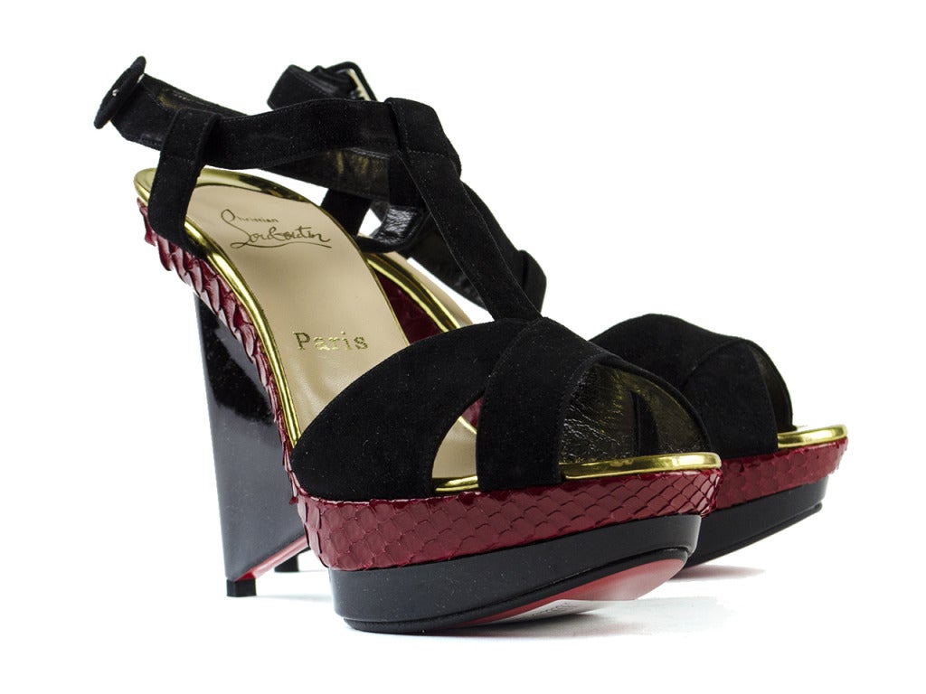 Make a statement in these sexy wedge heels! Wear for a night out on the town or for Sunday brunch with the girls! These gorgeous wedges feature black suede throughout the uppers with t-strap detailing and buckle at the ankles, red python throughout