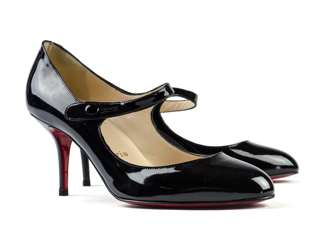 The perfect everyday mary janes! These Christian Louboutin 'Sock 70' heels will be a go to heel in your oh-so fashionable closet! These heels feature a functional ankle buckle closure, black patent leather throughout and approximate 3.5