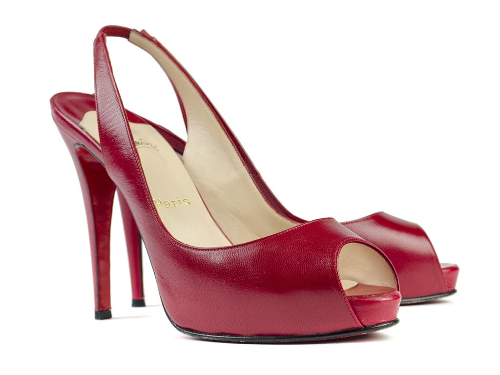Make a statement in these uber sexy Christian Louboutin prive heels in lipstick red! These heels feature the traditional Christian Louboutin red lacquer sole, red leather throughout, slingback. Heel measures approximately 5.25
