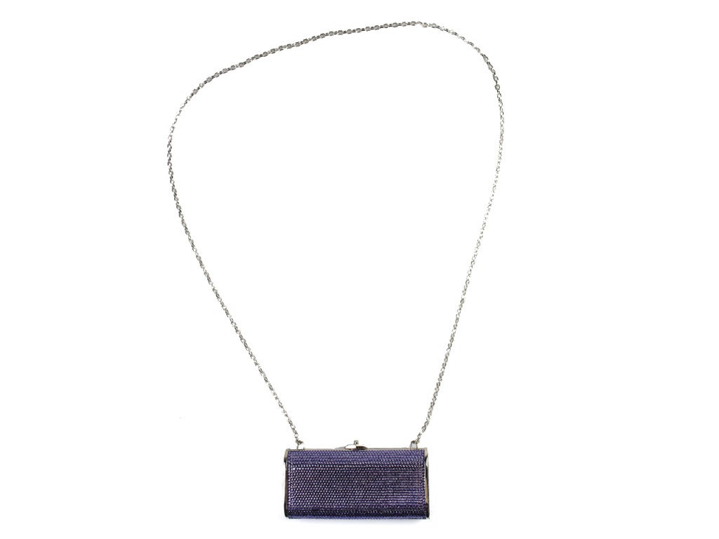 Sparkle and shine on that evening out with this Judith Leiber clutch. It is covered in lavender Swarovski crystals, pushlock, silver hardware, and long shoulder chain. With it's small rectangle shape, it makes it easy to carry and easy to get you