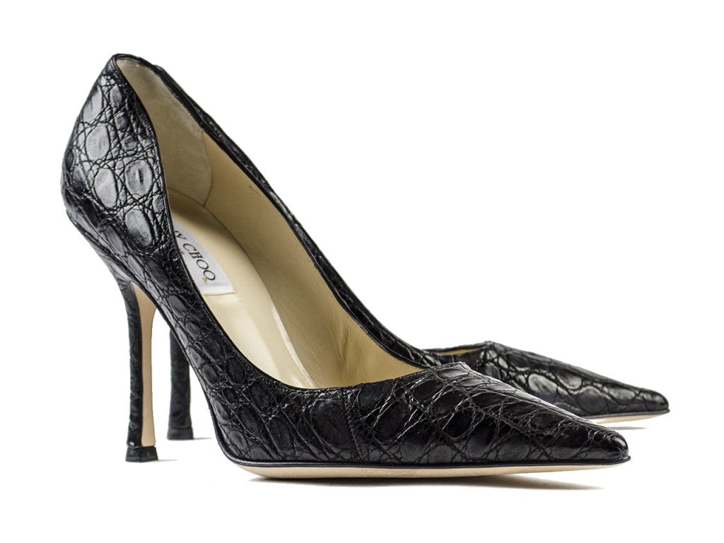 Go effortlessly from daytime business to nighttime fun in the Jimmy Choo 'Eros' black crocodile heels. Black crocodile leather makes a statement all its own on these pointed toe pumps yet works impeccably as a neutral, too! 

Heel Height: 3