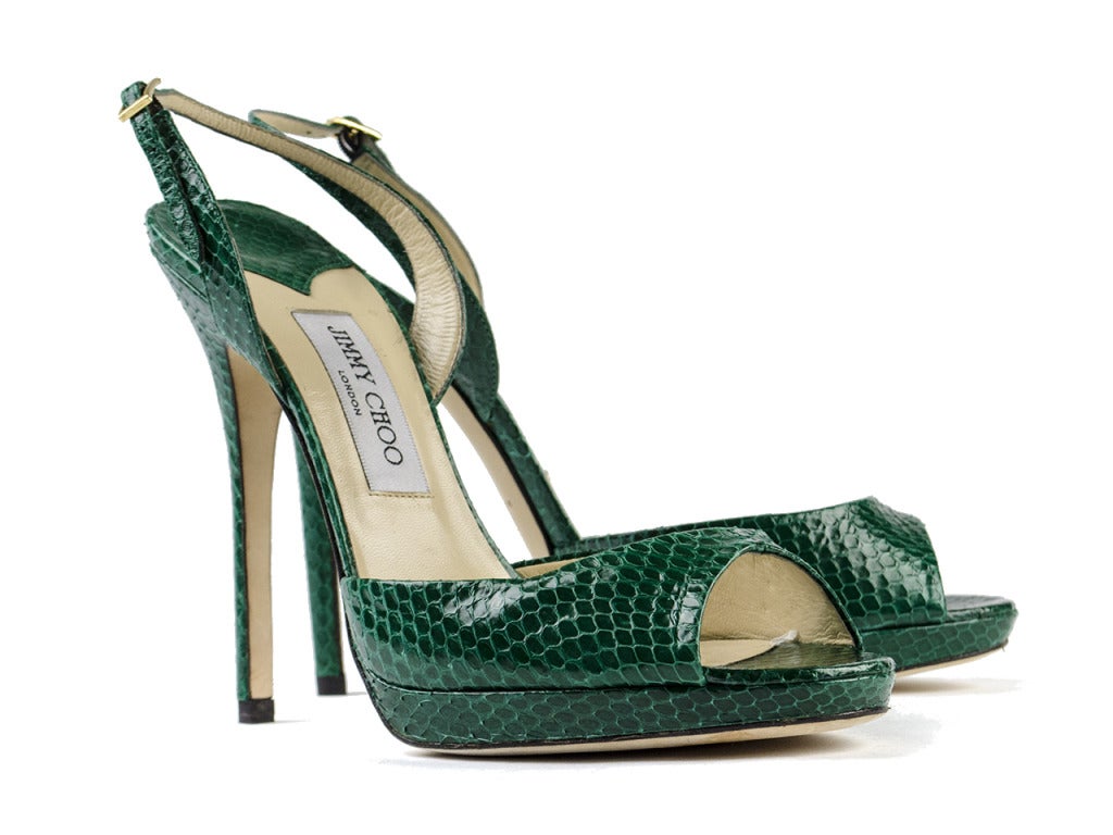 Gotta get that green! There's nowhere these emerald green elaphe snakeskin heels by Jimmy Choo won't take you. The simple peep toe cut at vamp and slingback strap at heel give all the attention to the rich green snakeskin leather... and how fabulous