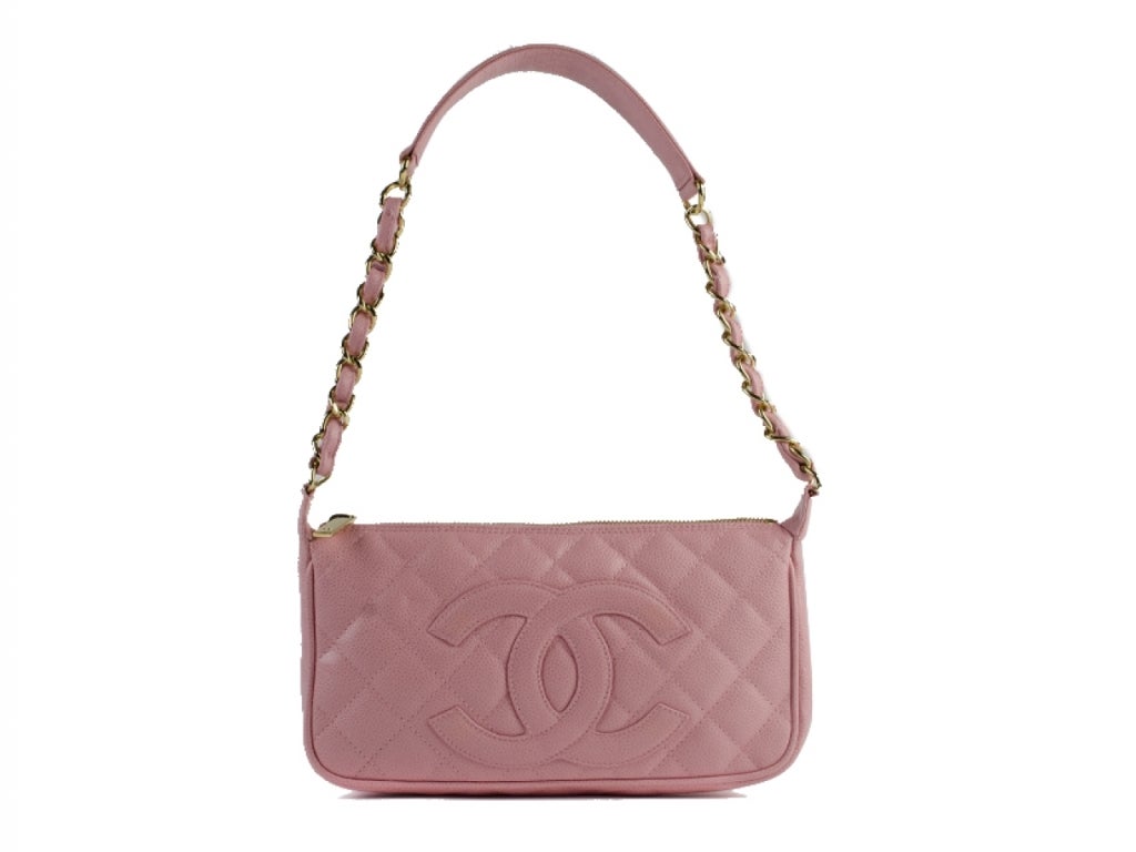 From the CHANEL Timeless Caviar Collection in pink features zip top closure with CHANEL engraved on zipper pull, CHANEL logo stitched on front,patch pocket on back. Pink fabric lining, one inside zippered pocket. Date Code: 9581958. Condition: Bag