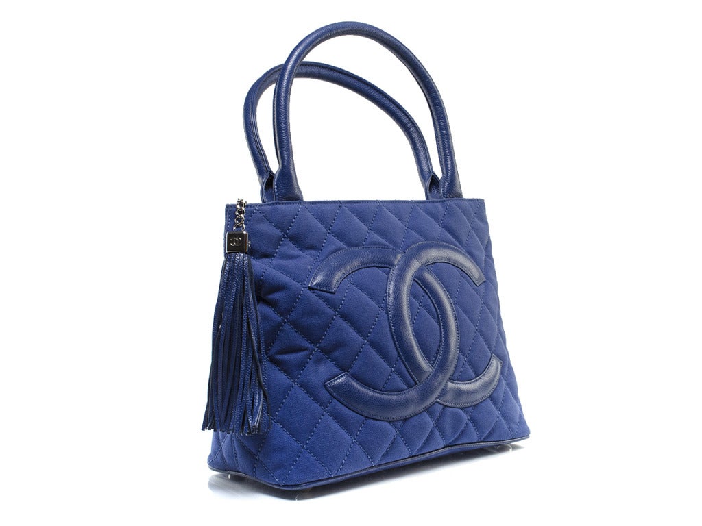 Pair this bag with a pair of on-trend denim Chanel espadrilles and shorts and you'll be ready to hit the town in no time! We love this Chanel tote for it's extreme versatility from day to night, spring to summer! This bag features the iconic Chanel