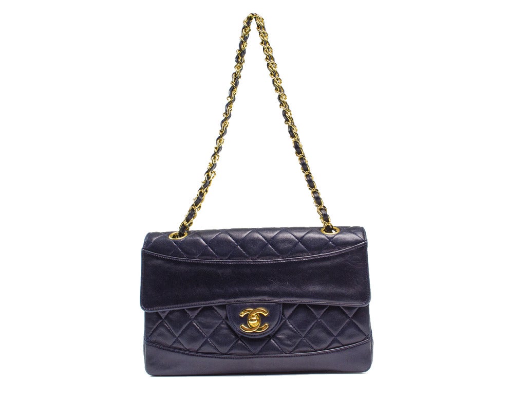 One can never go wrong with a classic Chanel flap! This iconic flap features traditional diamond quilting throughout in butter soft lambskin leather, one exterior pouch pocket. Interior features one pouch pocket as well as small mini wallet that