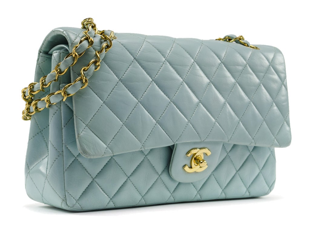 Just in time for spring! This Chanel bag is featured in butter soft blue leather, 18k plated gold hardware throughout, one exterior back pocket. Interior features double flap closure, one front pocket and two interior pouch pocket. Note: This bag