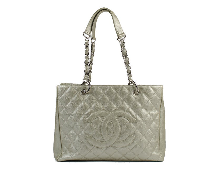 A beloved Chanel classic seen on celebrities and socialites, the crisp light gold GST tote with silver hardware will become one of your favorites in no time. Quilted canvas fabric is an original, exclusive to Chanel. 13.5