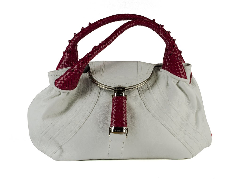 Bring out the naught and nice with this fierce white and red Fendi bag, lined with iconic Fendi print on interior. 11