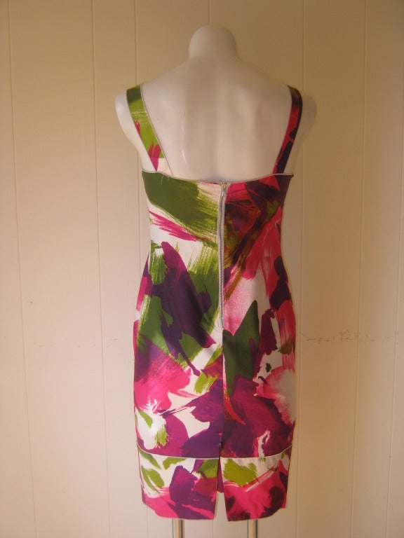 This silk dress has an allover multicolored paint brush stroke print with a very textured feel. There is an exposed zipper closure in the back, and this dress can be worn with sandals or some pretty slingbacks for the evening.