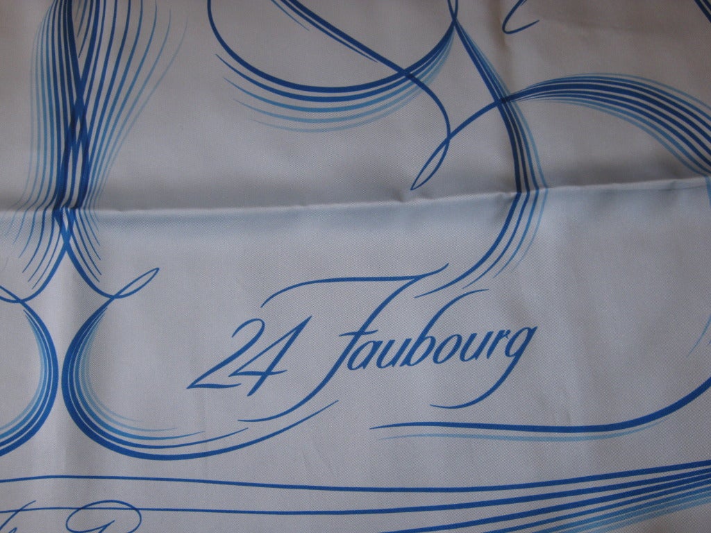 This scarf was never worn and is a made of silk twill measuring 35