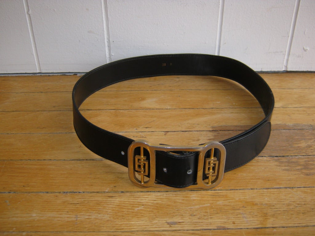 In great condition for its age, this black leather belt measures 34