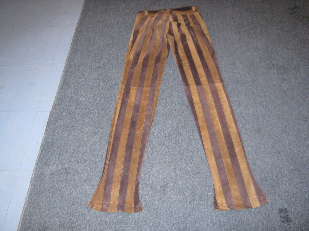 Two shades of brown is what you get with this striped pair of suede pants. The pants are half lined and have a front zip and snap closure.

Studded belt loops can be functional or decoration.

These pants would fit a size 0-2.