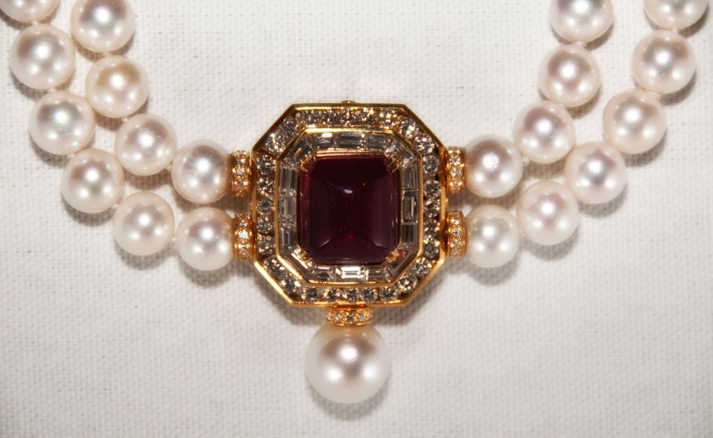 18k Sugar Loaf Cabochon Ruby (approx 20 carats) Diamond and Pearl Pendant convertible to a Brooch. A matching set of 4 South Sea Pearls which are detachable to create the Maltese Cross Form Brooch.  The 11-11.5 mm Cultured Pearl strands may be worn
