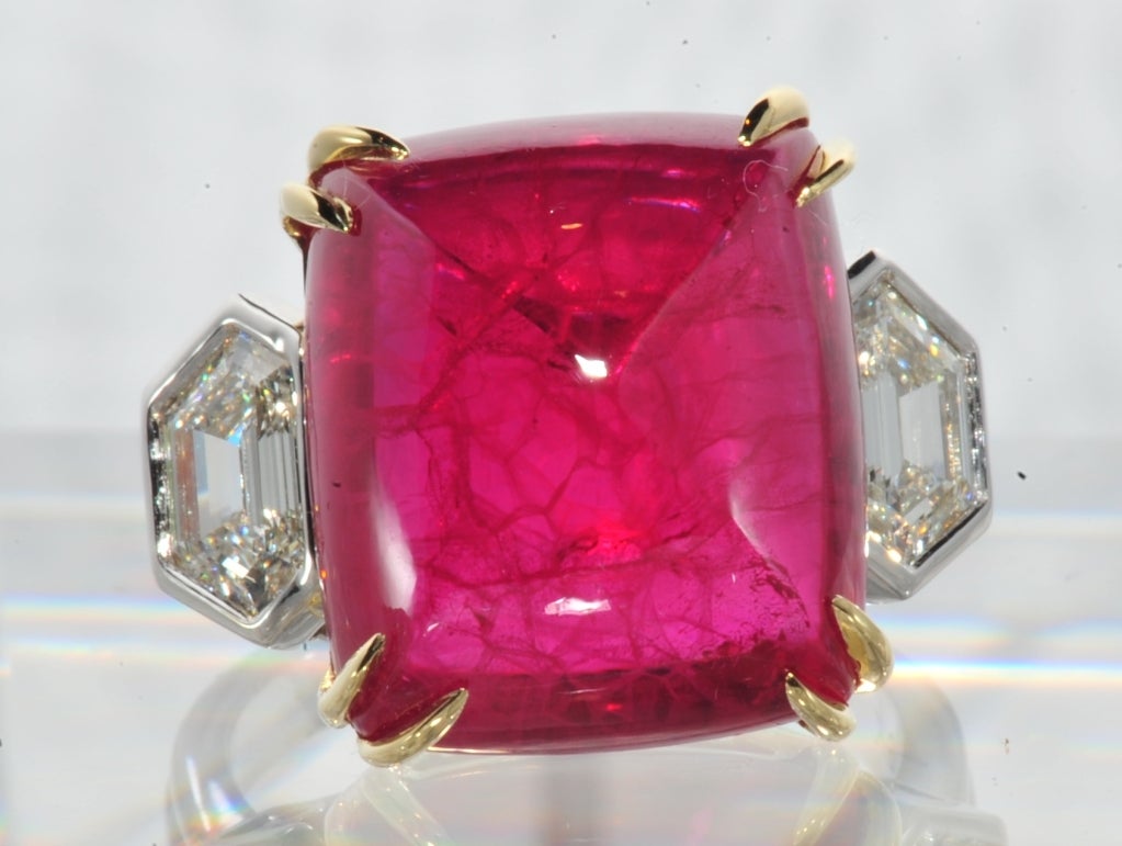 18k White and Yellow Gold set Sugar Loaf Cabochon Cut Ruby and Diamond Cocktail Ring.  Ruby Approx 30 Carats, two Shield Shaped Diamond approx. 1.60 carats total